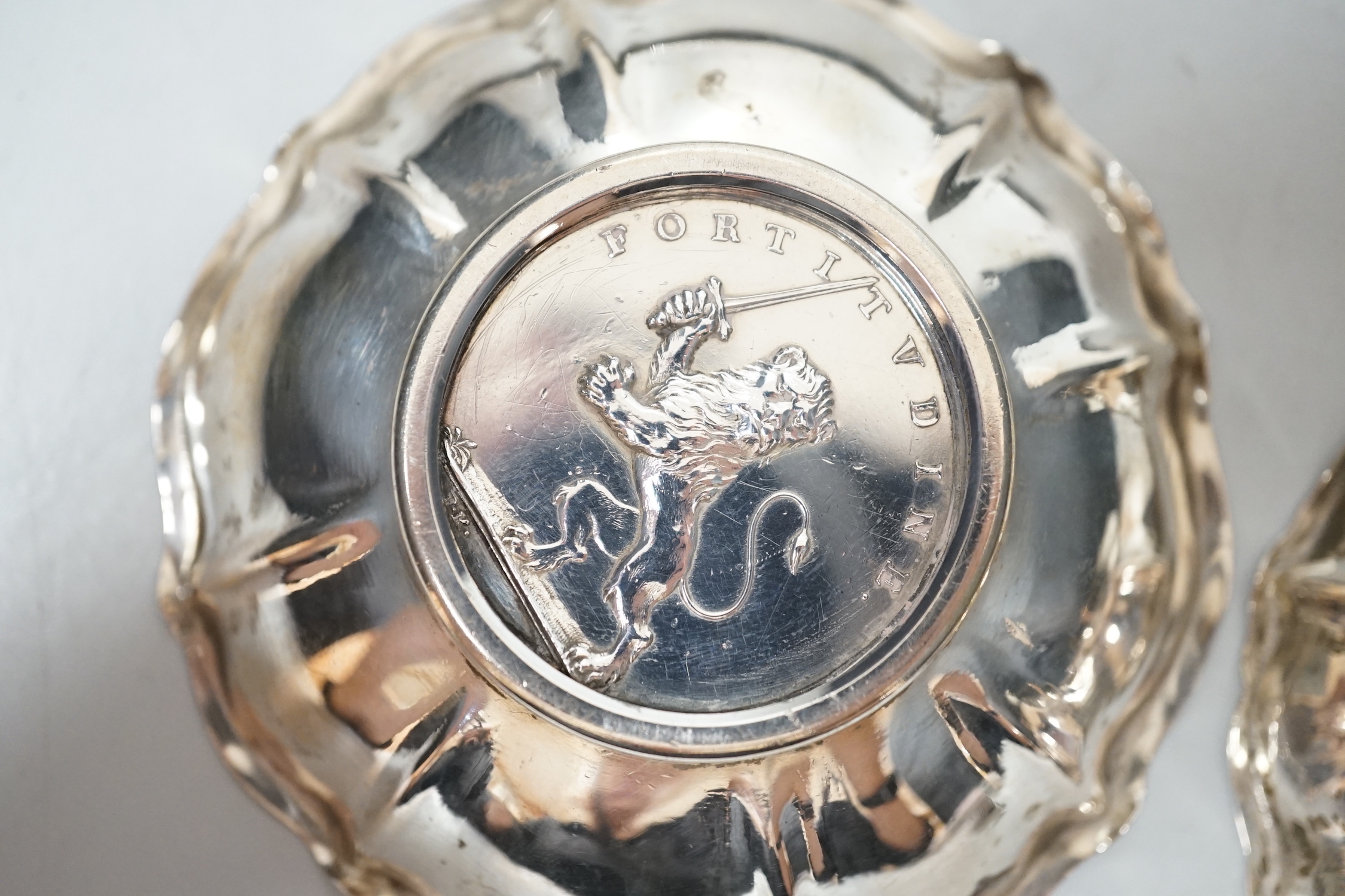 A 20th century Hungarian 800 standard white metal oval platter or stand, 33.2cm, and two 800 white metal bowls with inset coin bases, gross weight 15.5oz.